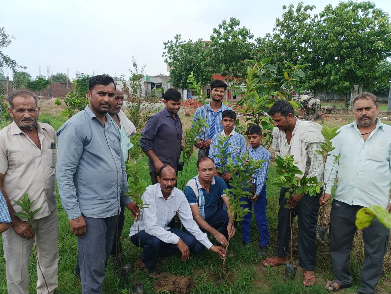 Residents and children at the planting ground